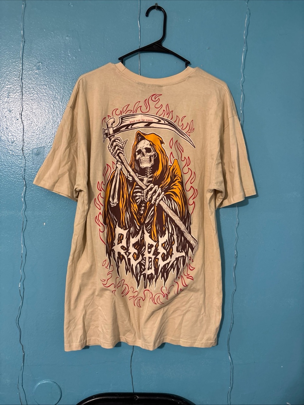 rebels Beige Short Sleeve Tee with Grim Reaper and Orange Hood Graphic